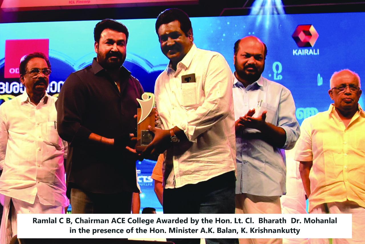 The Chairman receiving the award from Dr. Mohanlal